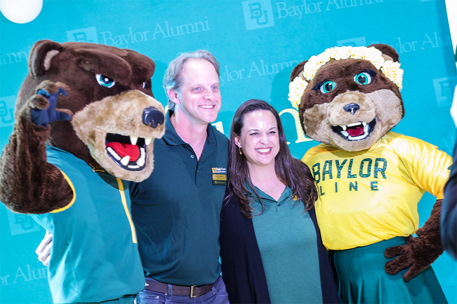 image of alumni with Baylor mascots Bruiser and Marigold