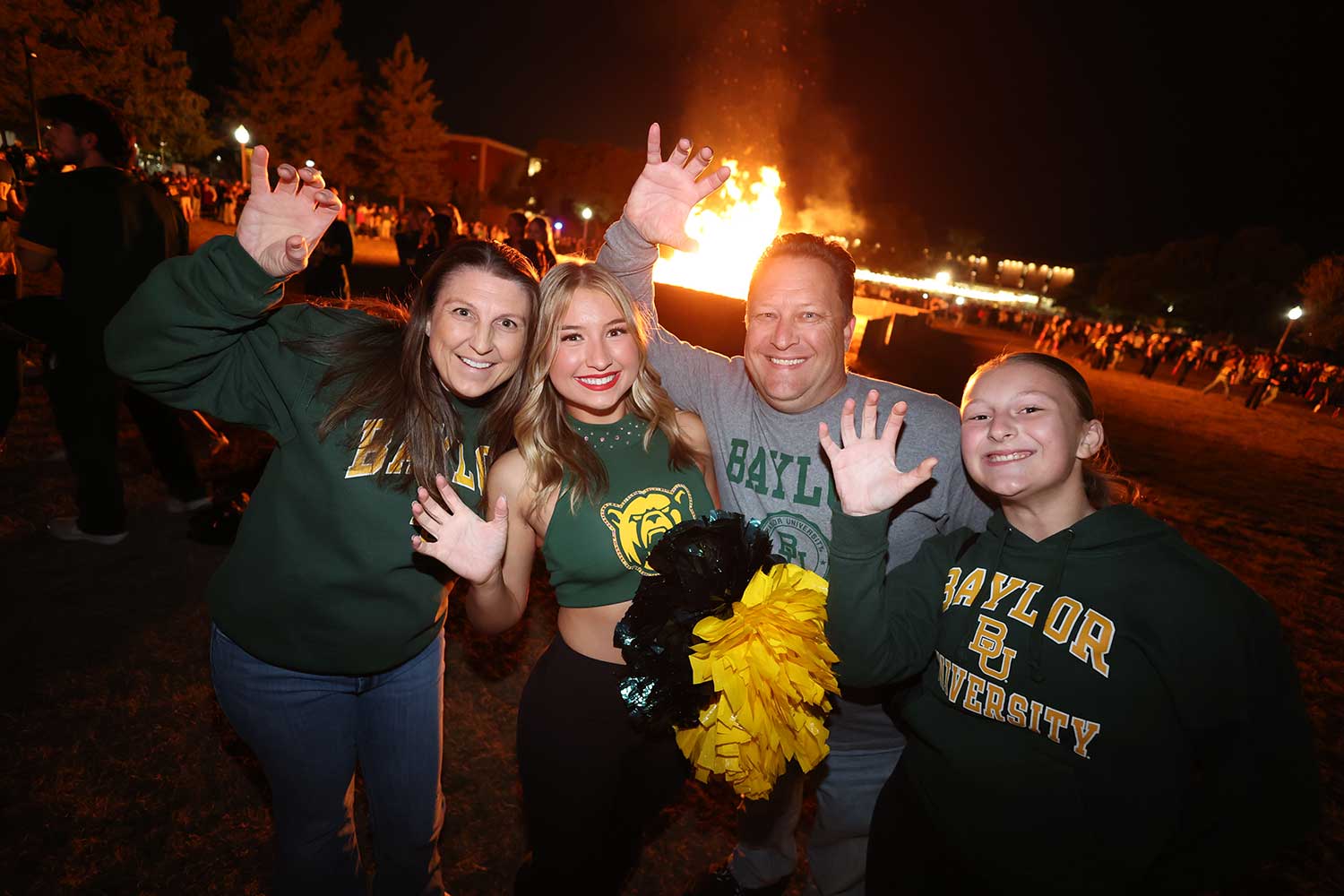 A family at Homecoming and Sic'Em