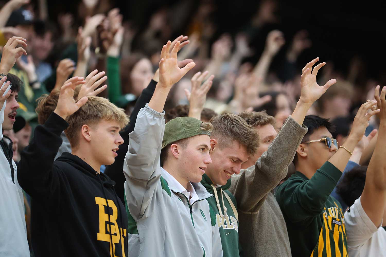 Sic Em Hand sign at the football game