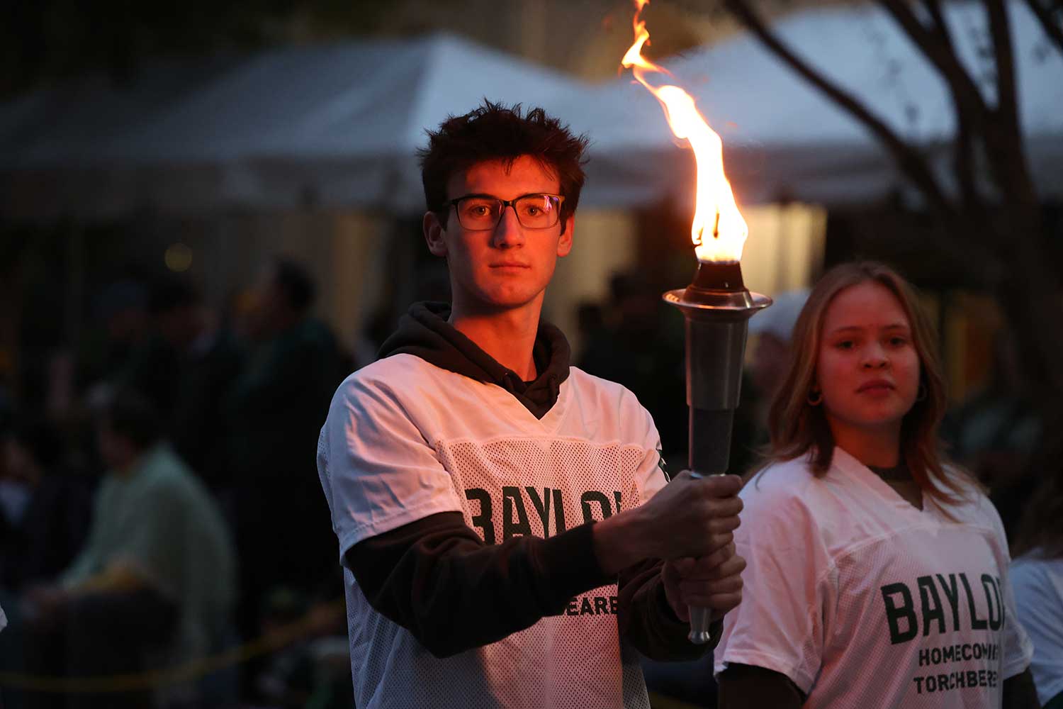 Baylor Student holding a torch
